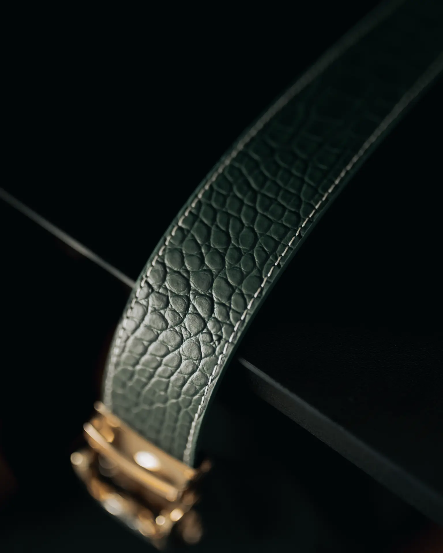 Croc embossed green leather strap detail