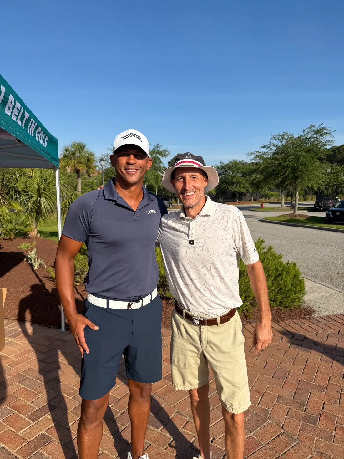 Member-guest golfers in their Dartee belts